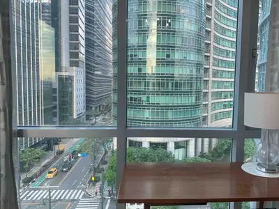 a window with a view of a city street at Avant at the Fort 360 City Center views in BGC Taguig w Pool Access in Manila