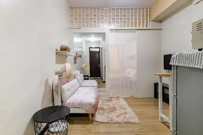 a living room with a couch and a table at Self-Checkin - Piekny Dom - A Beautiful Home in Manila