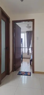 a living room with a door and a mat on the floor at 1Bedroom2603A Sunshine100Tower3 70Inches TV Pool Karaoke in Manila