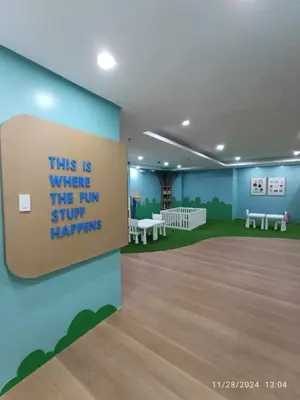 a room with a sign that reads this is when the run stuff happens at 1Bedroom2603A Sunshine100Tower3 70Inches TV Pool Karaoke in Manila