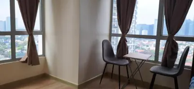 a room with two chairs and a table in front of windows at 1Bedroom2603A Sunshine100Tower3 70Inches TV Pool Karaoke in Manila