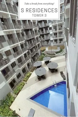 a view of a apartment complex with a swimming pool at S Residences MOA complex in Manila