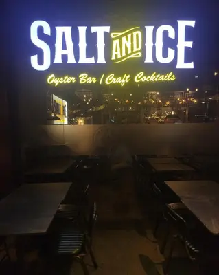 a sign that says salt and ice on the window of a restaurant at Stylish 1br inside BGC at Uptown Parksuites - 24k in Manila