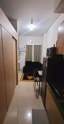 a living room with a couch and a table at Leaf residences condotel 2bedroom Muntinlupa in Manila