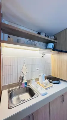 a kitchen with a sink and a counter top at Student Hub at DLSU in Pasong Bayog