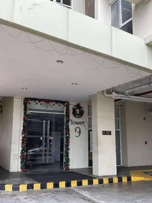 a front door of a building with christmas decorations at Modern Studio Condominium 2 in Manila