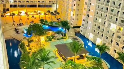 an aerial view of a resort with a swimming pool at Shore Escape PH in Manila