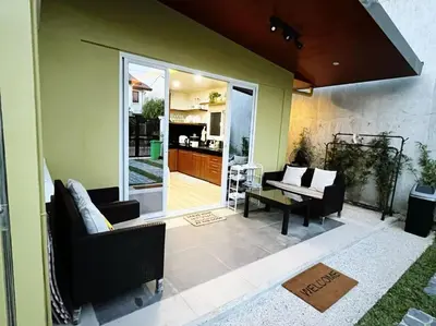 a living room with a couch and a table at C&G Staycation Home in General Trias