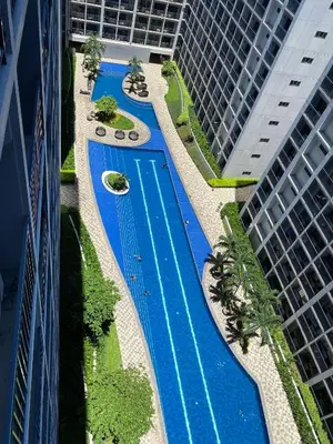 an overhead view of a swimming pool between two buildings at Shore 2 Residence Tower 2 in Manila