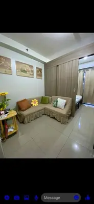 a living room with a couch in a room at Shore 2 Residence Tower 2 in Manila