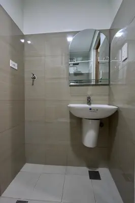 a bathroom with a sink and a mirror at MOA Shorescape City Life with WiFi in Manila