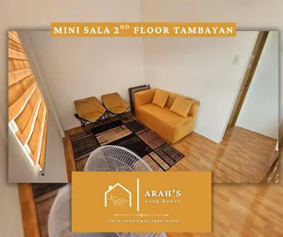 a picture of a living room with a couch and a floor tamarawk at Arah Cozy House in Dasmariñas