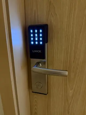 a close up of a door with a clock on it at Sea Residences - MOA in Manila