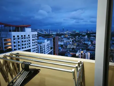 a view of a city at night from a building at Modern Studio Condo in Heart of Quezon City in Manila