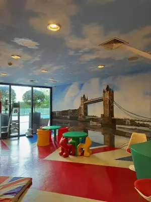 a room with a mural of the tower bridge at Sleek Designer Studio at Knightsbridge Residences in Manila