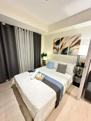 a bedroom with a large bed in a room at 1BR Condotel in Azure Urban Resort Near NAIA #BH1 in Manila