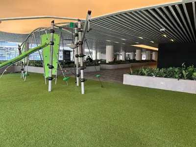 a playground in a building with a slide at Air Residences staycation2 in Manila