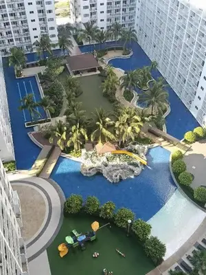 an aerial view of a resort with a swimming pool at Shore Stay in Manila