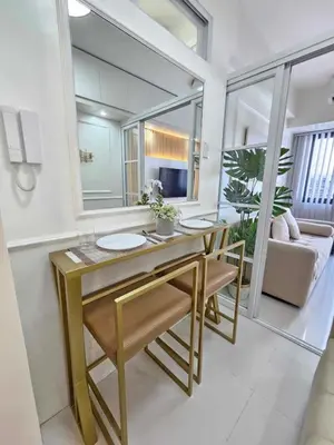 a bathroom with a table with two sinks and a mirror at Stylish and Glamours Haven in Manila