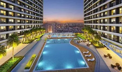 an aerial view of a building with a swimming pool at Stylish City Escape in Manila
