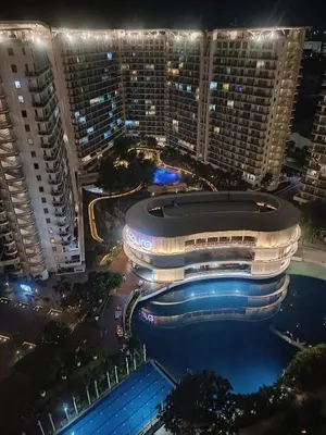 a night view of a building in a city at Azure Urban Resort Staycation in Manila