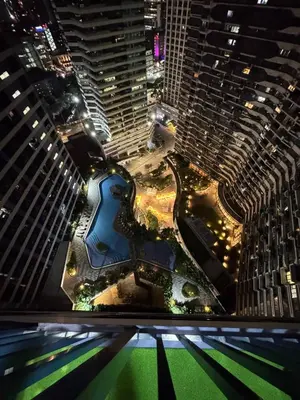 an aerial view of a city at night with tall buildings at Entire Room in Makati Center with FAST WIFI in Manila