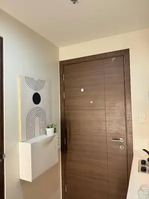 a wooden door in a room with at Entire Place in Central Makati in Manila