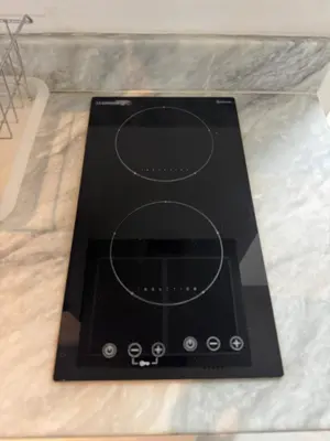 a black appliance sitting on top of a counter at Modern Condo with Premium Beach View at Azure Urban Resort Residences - Vesta Property in Manila