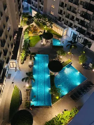 an overhead view of a pool in a building at Staycation 15 minutes from NAIA with Massage Chair in Manila