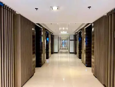 a hallway of a building with black and white closets at SLY Staycation at Shore Residences Mall of Asia in Manila