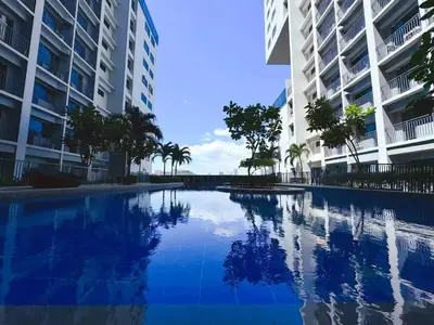 a swimming pool in the middle of two buildings at shore 2 tower 3 near moa in Manila