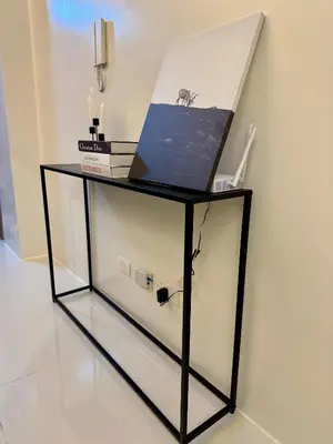 a glass shelf with a laptop on top of it at Jays BnB in Manila