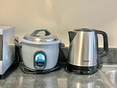 a tea kettle sitting on top of a kitchen counter at Studio Condo by Sea Residences near MOA 03 in Manila