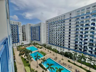 an aerial view of a large apartment building at Studio Condo by Sea Residences near MOA 03 in Manila