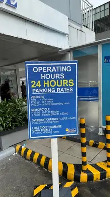 a sign on the street in front of a store at Spacious Condo at Shell Residences, MOA Pasay - The Urban Stay in Manila