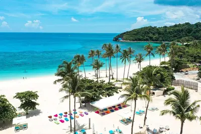 an aerial view of a beach with palm trees and the ocean at Sea View older in Manila