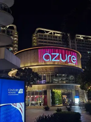 a building with a large sign on it at night at 15 Mins Away from NAIA Perfect for Staycation in Manila