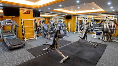 a gym with several treadmills and elliptical machines at Ortigas CBD Near Business & Shopping Hubs in Manila
