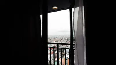 a view of a city from a window at Smart Cozy Home Air Residences Makati 4125 in Manila