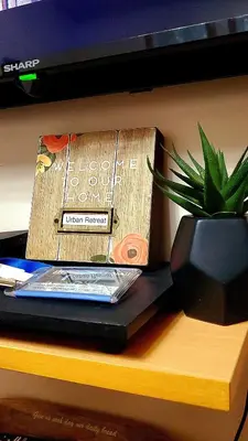 a book sitting on a table next to a potted plant at Urban Retreat at Shell Residences with Netflix 300mbps Wifi in Manila