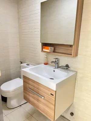a bathroom with a sink and a toilet at R&R Entire Rental Unit in Manila