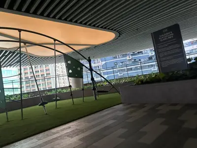 a room with a swing in a building with windows at Air Residences 3 by AG in Manila