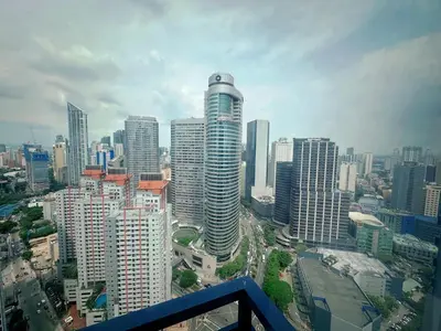 a view of a city with tall buildings at Air Residences 3 by AG in Manila