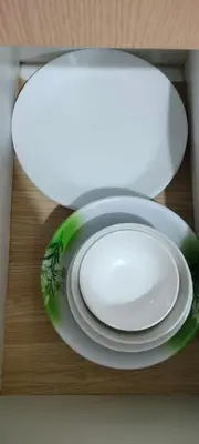 a white plate sitting on a table with a plate at Bb Drew Rooms Near Airports in Manila