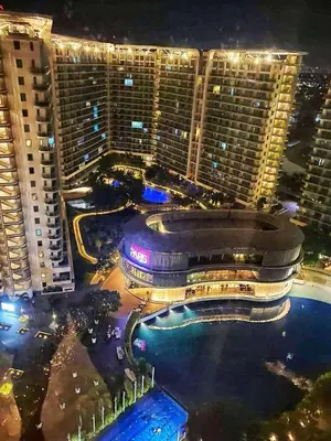 an aerial view of a city at night at St Tropez PH 07 in Manila