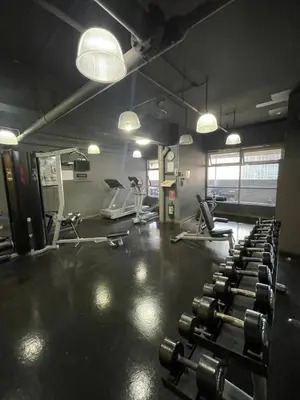 a gym with several rows of exercise bikes and lights at A venue Residences 1801 in Manila
