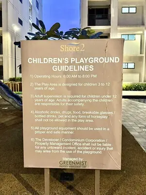 a sign in front of a building at 1 Bedroom Condo at Shore 2 Near Airport with Balcony & Pool View in Manila