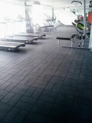 a gym with rows of benches in a room at Cozy 1BR Condo at Jazz Residences in Manila