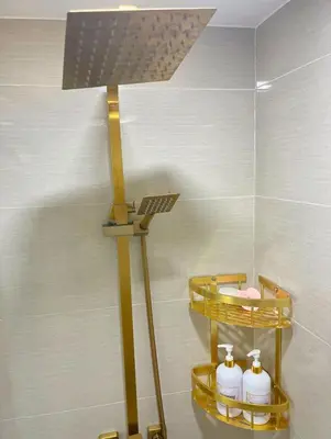 a light in a bathroom with two shelves at Chic BGC Stay - Hotel Vibes in Manila