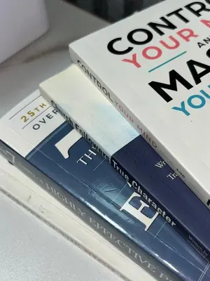 a stack of books sitting on top of each other at Elim Escape Staycation in Trece Martires